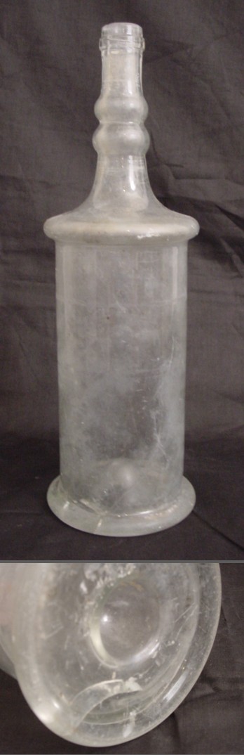 A clear glass bottle whose surface has gone completely matt with corrosion, beside an untouched one