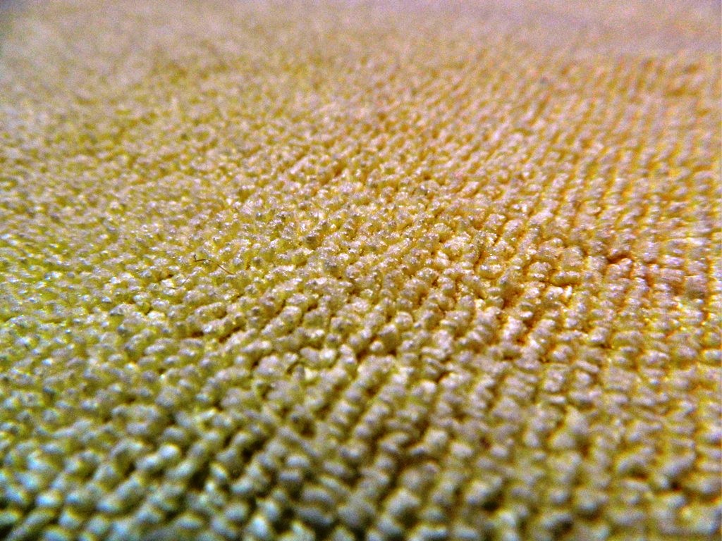 A macro shot of the looped pile of a microfibre cloth filling the frame