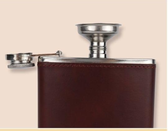 Filling an 8 oz hip flask using the included stainless funnel